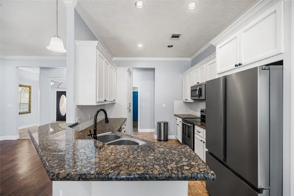 a view of a kitchen and a window