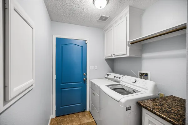 a kitchen with stainless steel appliances granite countertop a sink stove and microwave