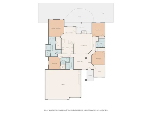 a front view of a house with a garden and trees