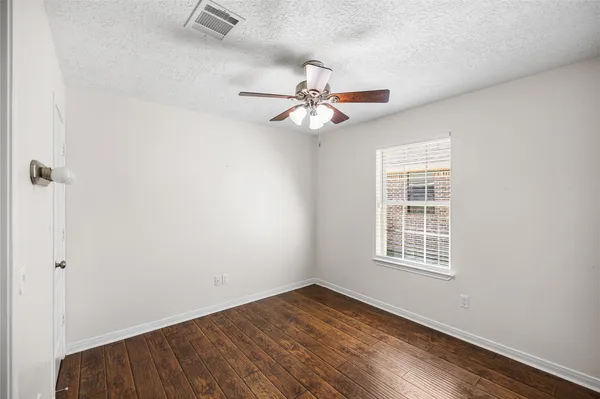 a bathroom with a shower and a sink