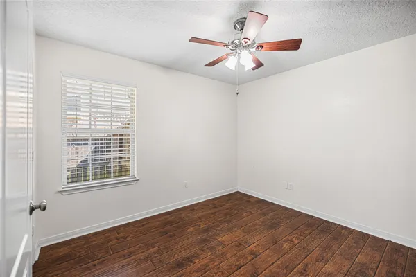 an aerial view of a house with a swimming pool