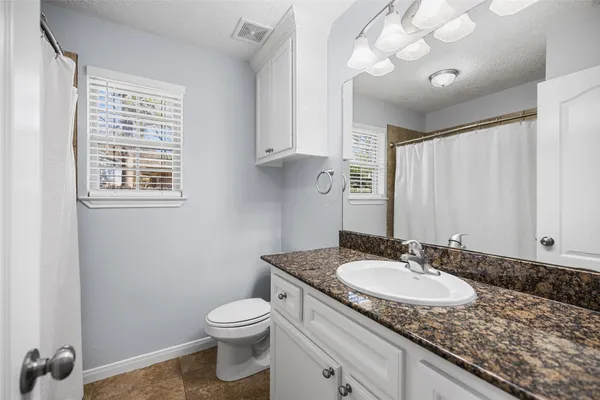 a front view of house with yard and outdoor seating