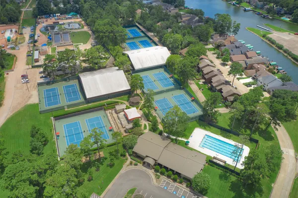 a view of a house with backyard sitting area and garden