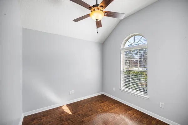 a view of a hallway with chandelier and entryway
