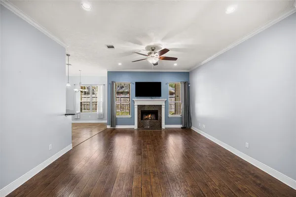 a view of a hallway with chandelier and entryway