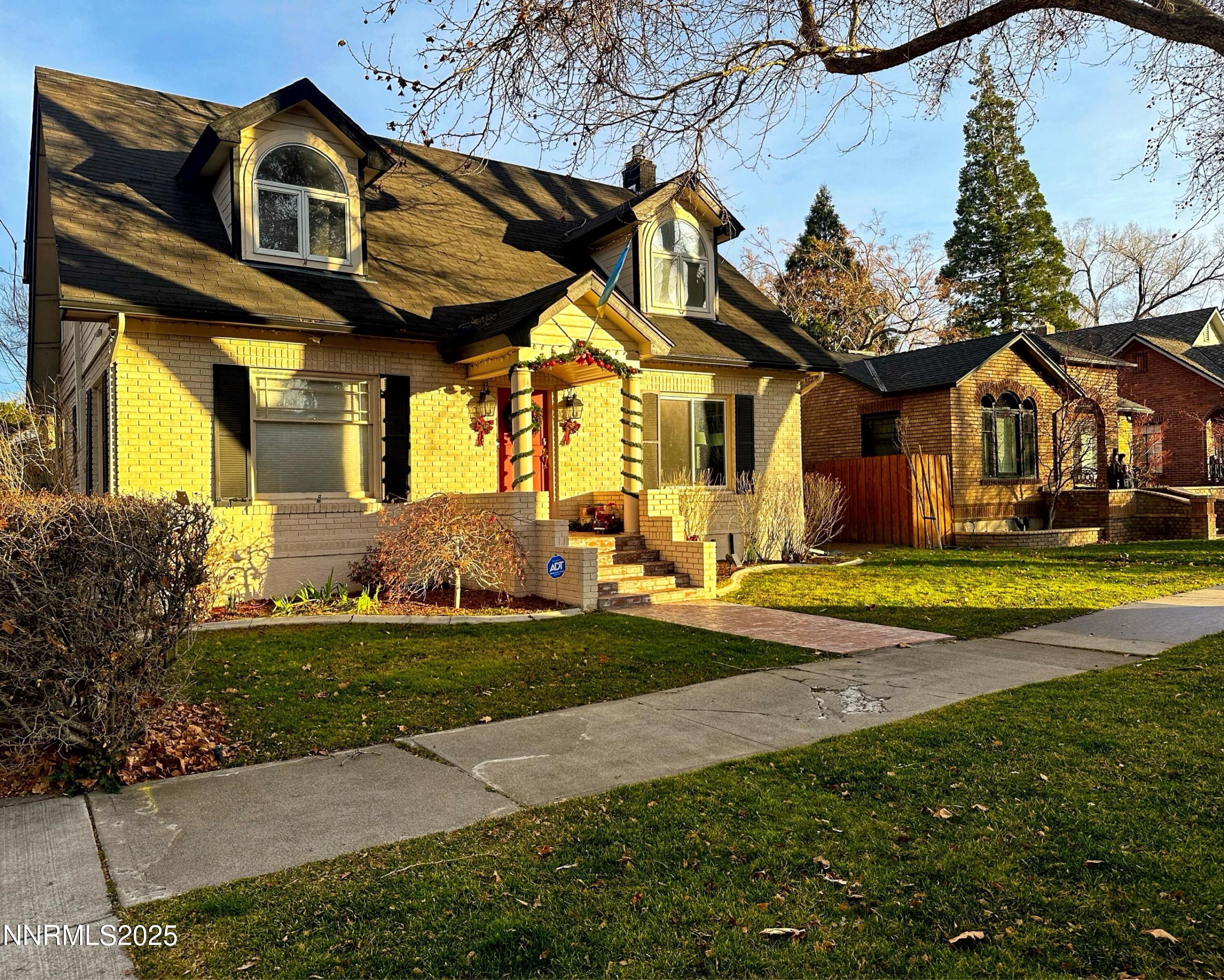 611 Nixon Avenue Reno, NV 89509 - Photo 36 of 43 a view of a big house with a fountain and plants