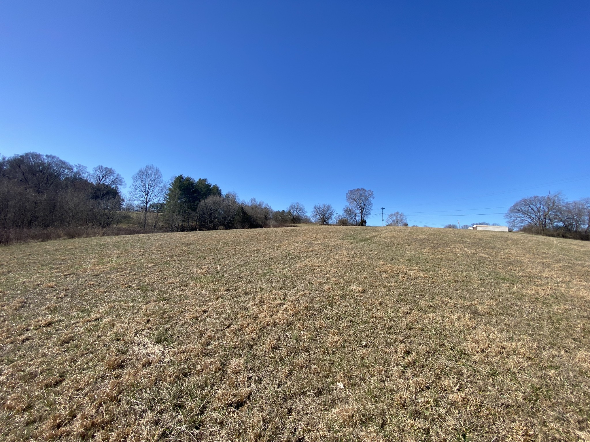 0 South Walker Road Pleasant View, TN 37146 - Photo 8 of 9 a view of a field with a building in the background
