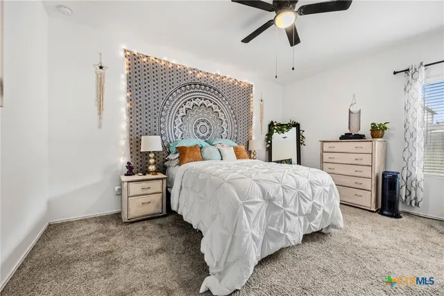 a bed room with a bed and dresser