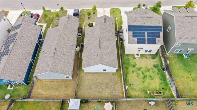 an aerial view of a house with outdoor space