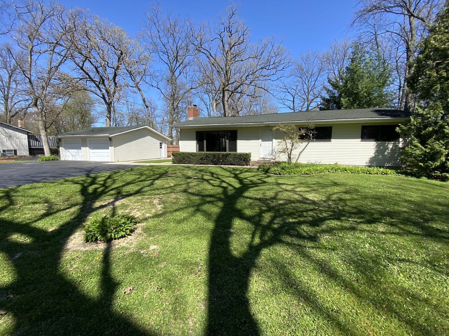 708 Hickory Road Woodstock, IL 60098 - Photo 1 of 22 a front view of a house with garden