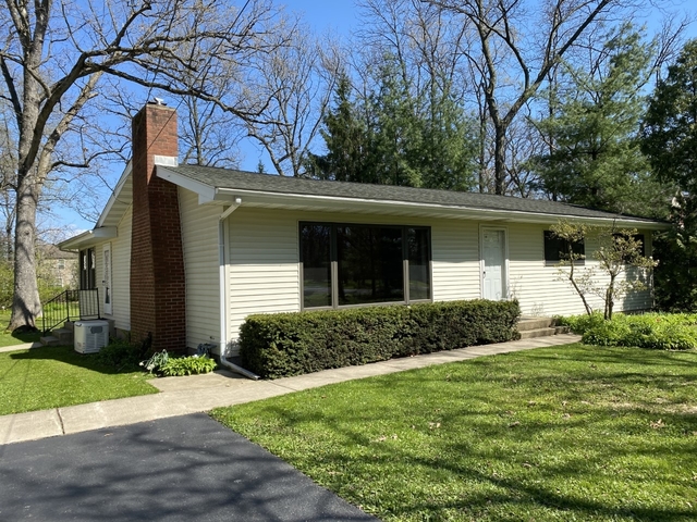 708 Hickory Road Woodstock, IL 60098 - Photo 2 of 22 a front view of a house with garden