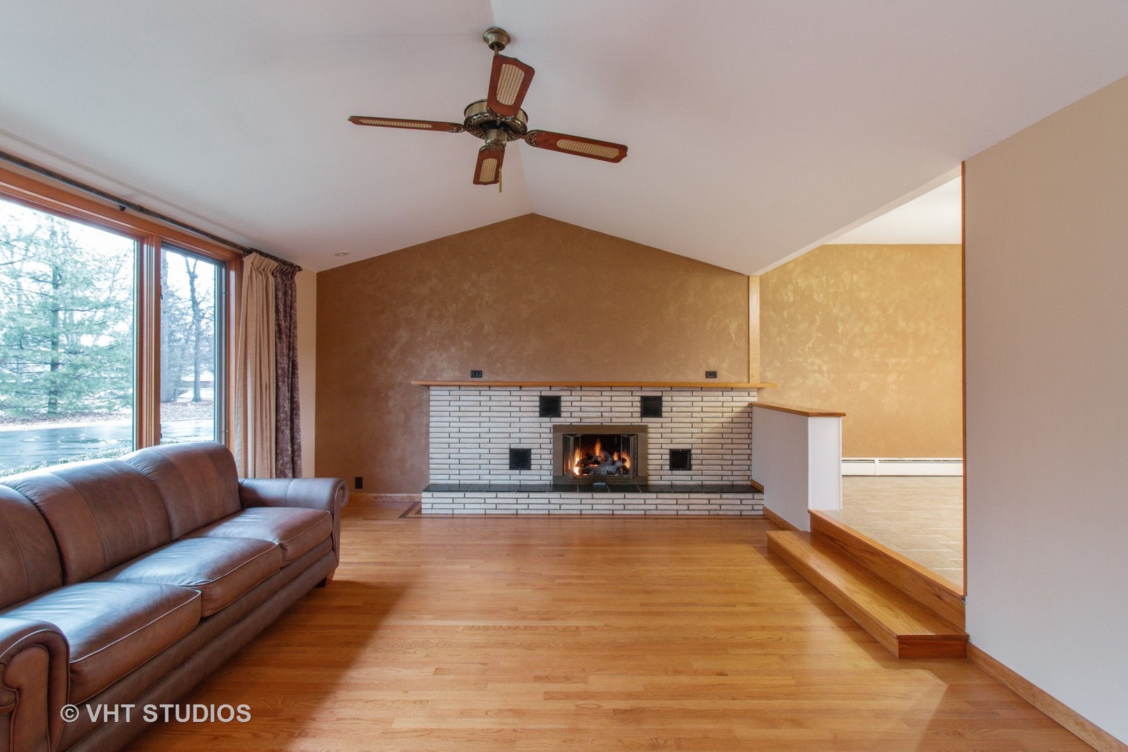 708 Hickory Road Woodstock, IL 60098 - Photo 11 of 22 a living room with furniture and a fireplace