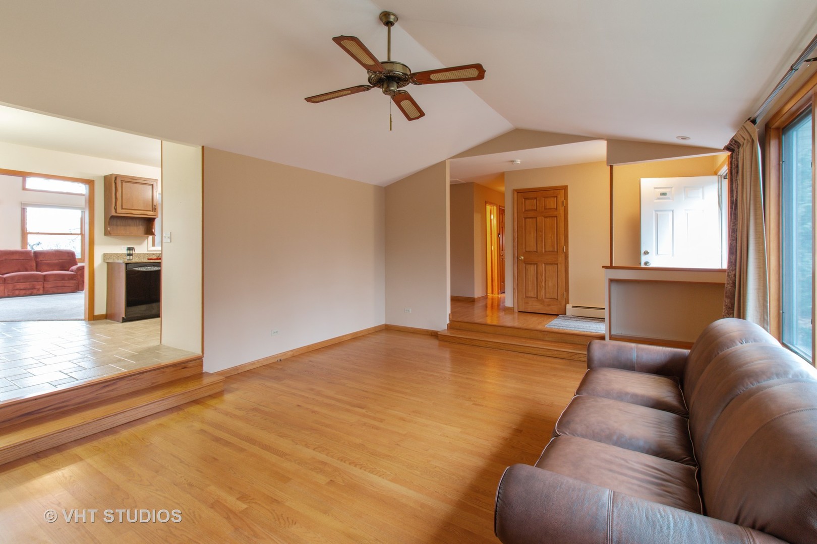 708 Hickory Road Woodstock, IL 60098 - Photo 12 of 22 a living room with furniture window and a ceiling fan