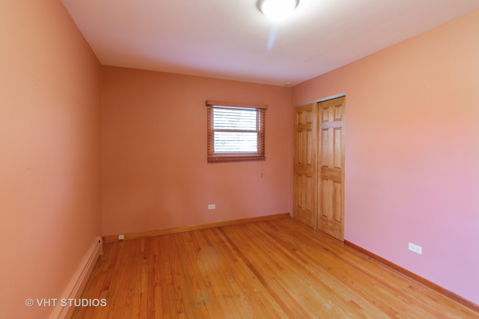 708 Hickory Road Woodstock, IL 60098 - Photo 15 of 22 an empty room with wooden floor and windows