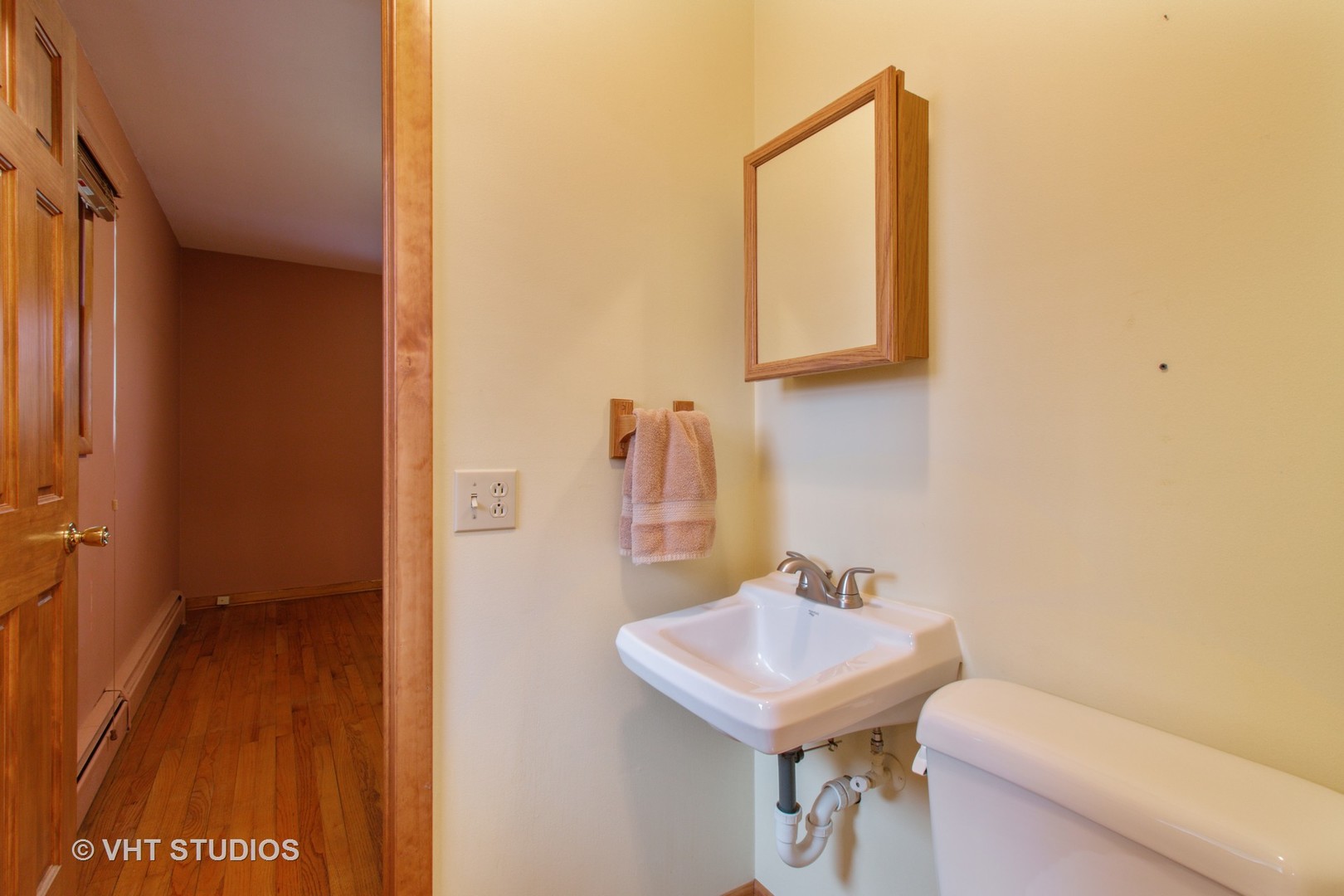 708 Hickory Road Woodstock, IL 60098 - Photo 17 of 22 a bathroom with a sink a toilet and mirror