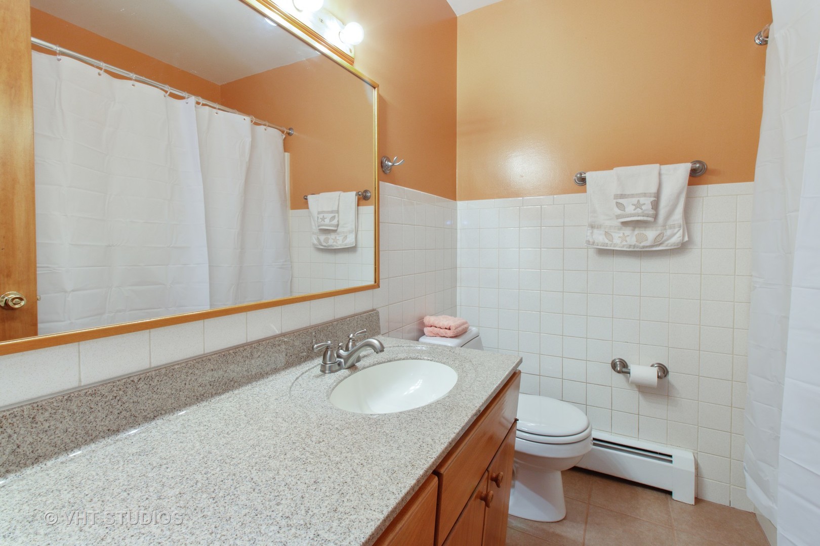 708 Hickory Road Woodstock, IL 60098 - Photo 18 of 22 a bathroom with a granite countertop sink and a mirror