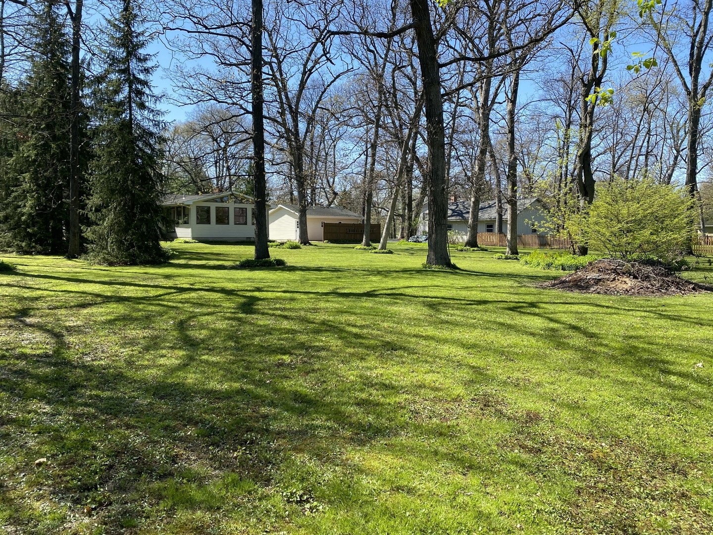 708 Hickory Road Woodstock, IL 60098 - Photo 21 of 22 a big yard with lots of trees and plants