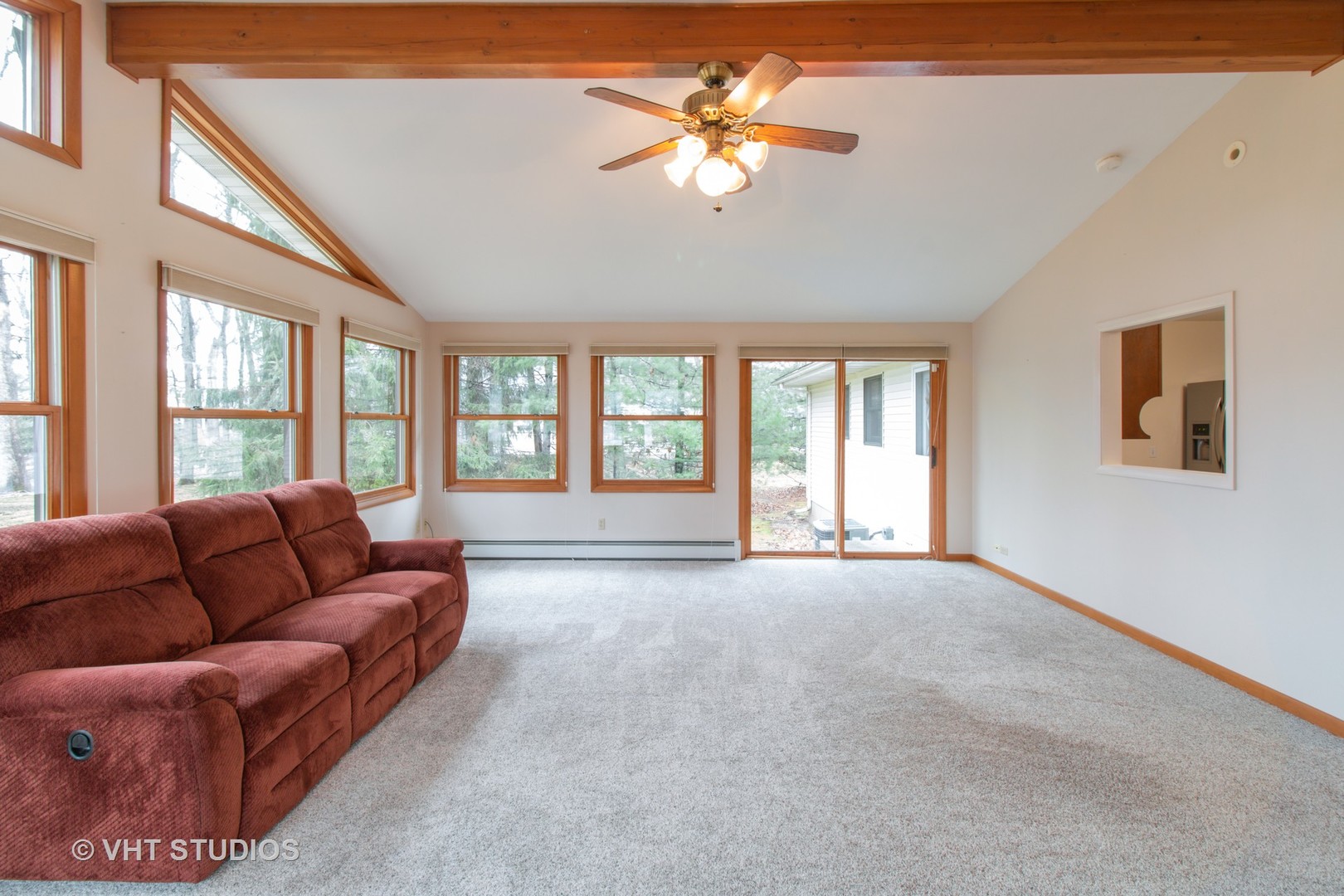 708 Hickory Road Woodstock, IL 60098 - Photo 6 of 22 a living room with furniture and a large window