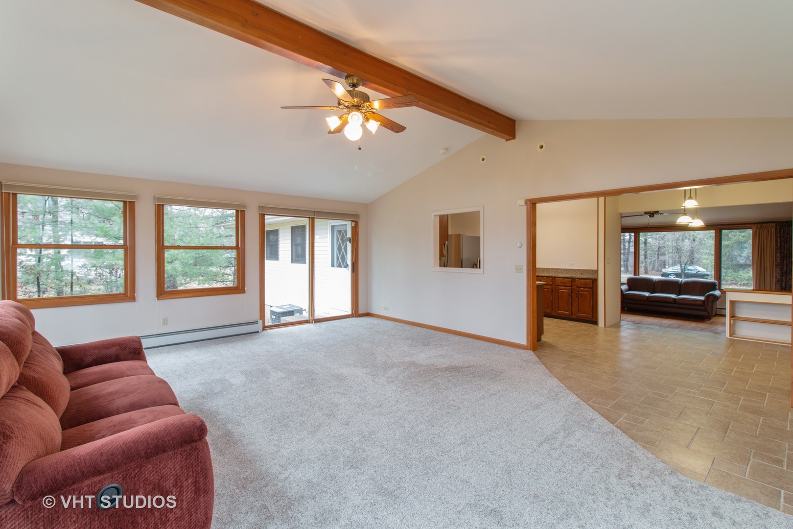 708 Hickory Road Woodstock, IL 60098 - Photo 10 of 22 a living room with furniture and a large window