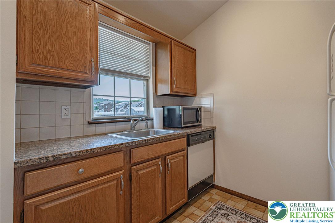 25 North 8th Street Emmaus, PA 18049 - Photo 29 of 51 A well-appointed kitchen featuring solid wood cabinetry and a view to the outside.