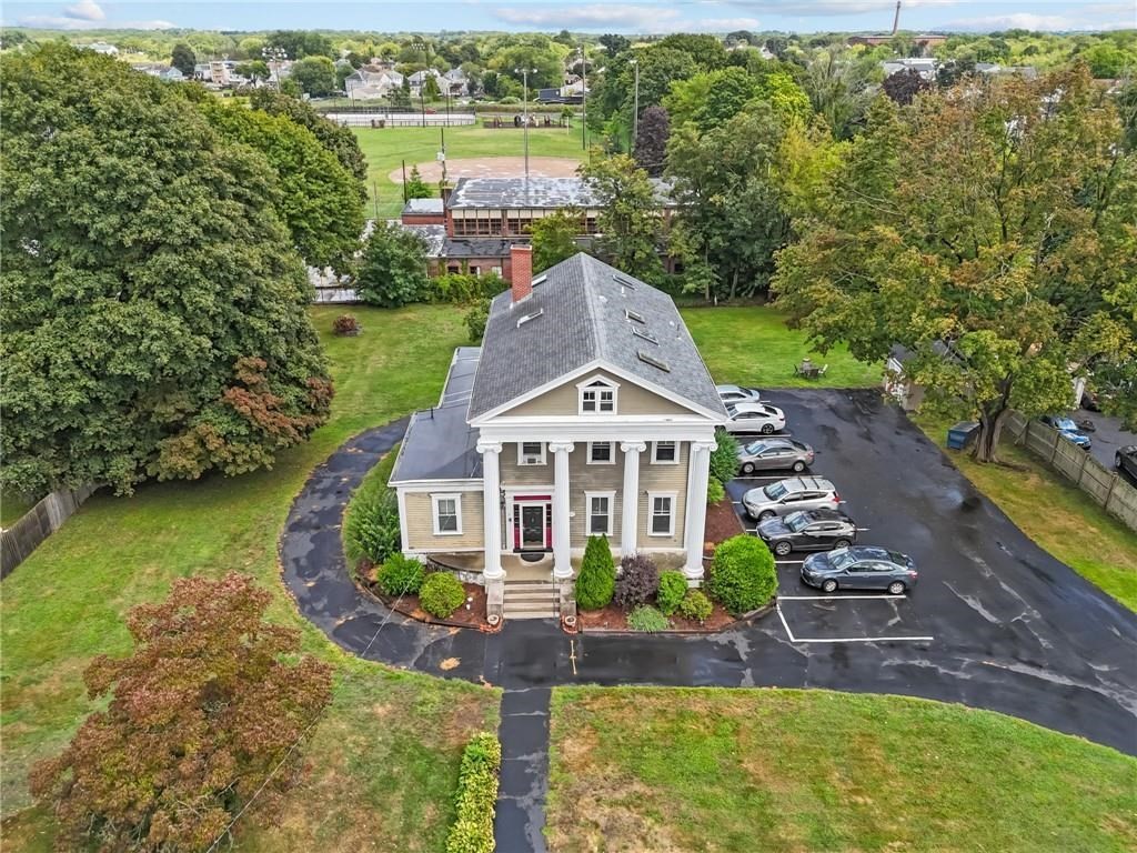 21 Federal Street Warren, RI 02885 - Photo 1 of 27 an aerial view of a house with a garden and lake view