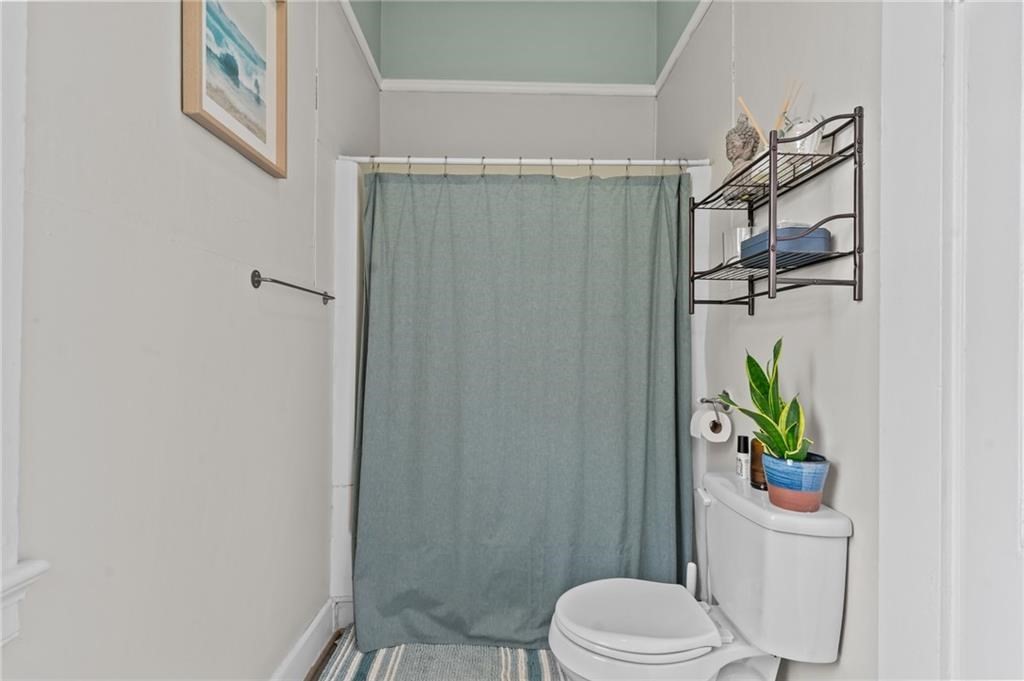 21 Federal Street Warren, RI 02885 - Photo 13 of 27 a bathroom with a toilet and a shower