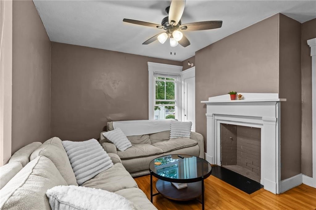 21 Federal Street Warren, RI 02885 - Photo 14 of 27 a living room with furniture and a fireplace