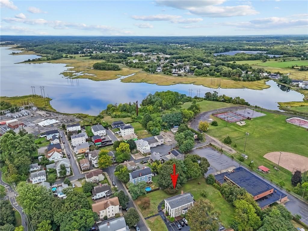 21 Federal Street Warren, RI 02885 - Photo 2 of 27 an aerial view of ocean and residential houses with outdoor space