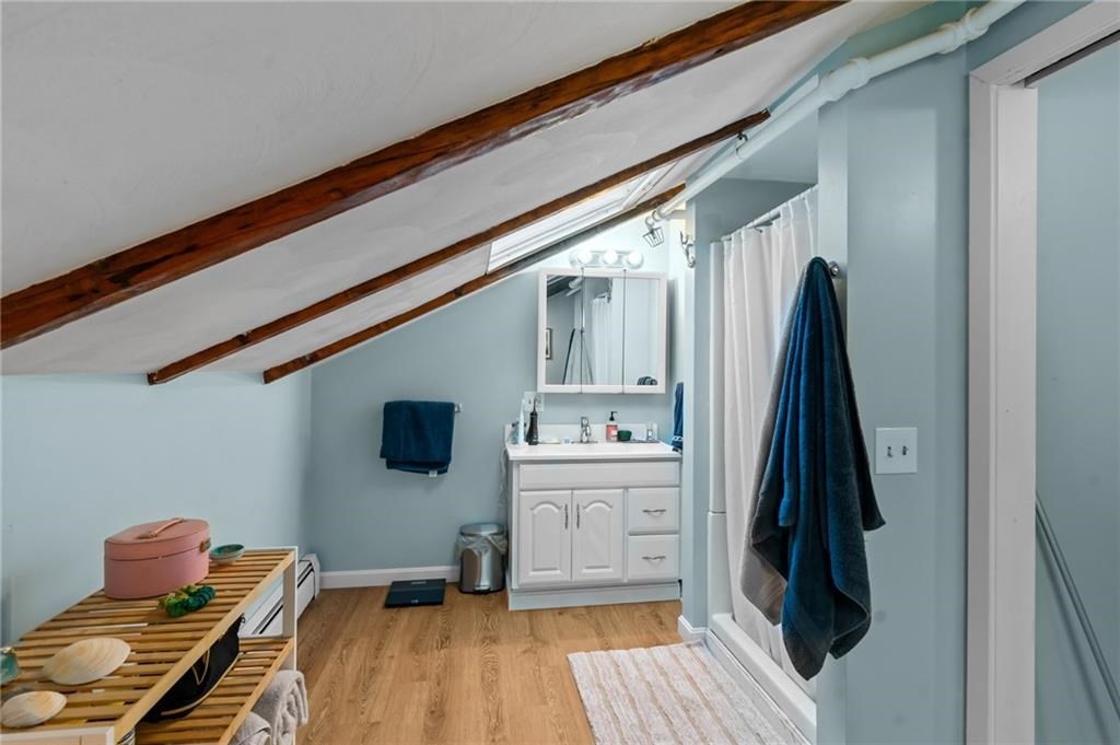 21 Federal Street Warren, RI 02885 - Photo 22 of 27 a room with a flat tv screen and a dresser
