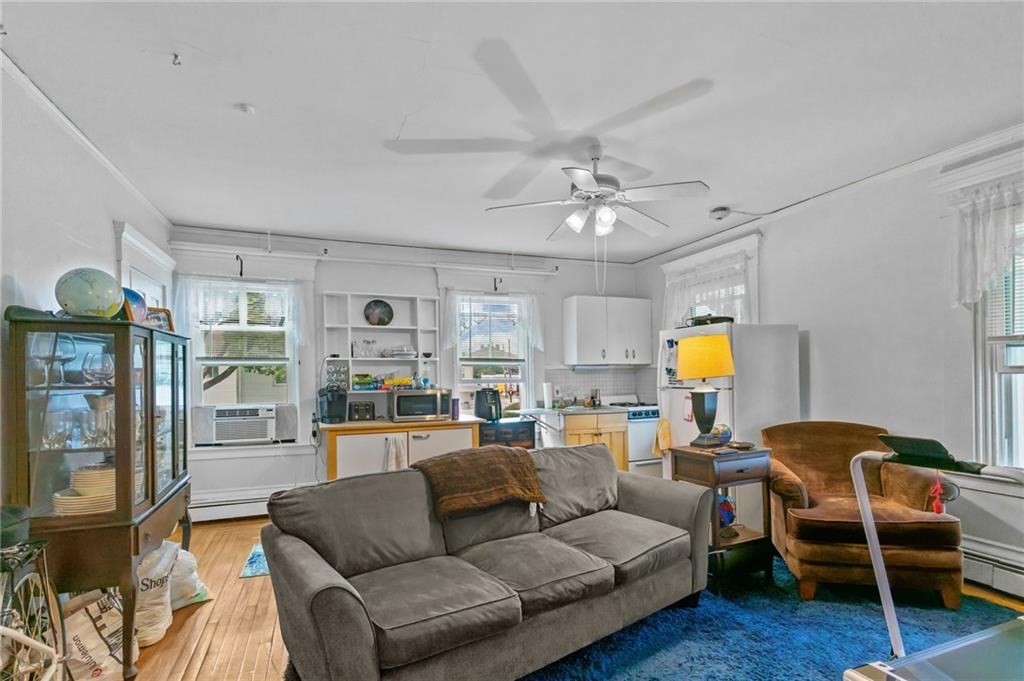 21 Federal Street Warren, RI 02885 - Photo 26 of 27 a living room with furniture and wooden floor