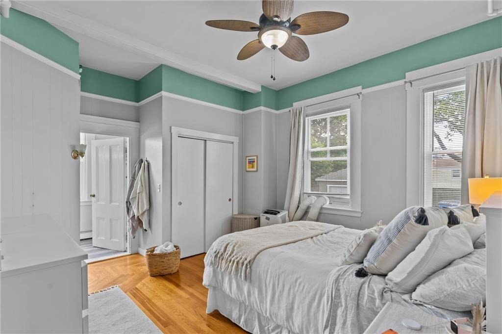 21 Federal Street Warren, RI 02885 - Photo 9 of 27 a bedroom with a bed ceiling fan and a window