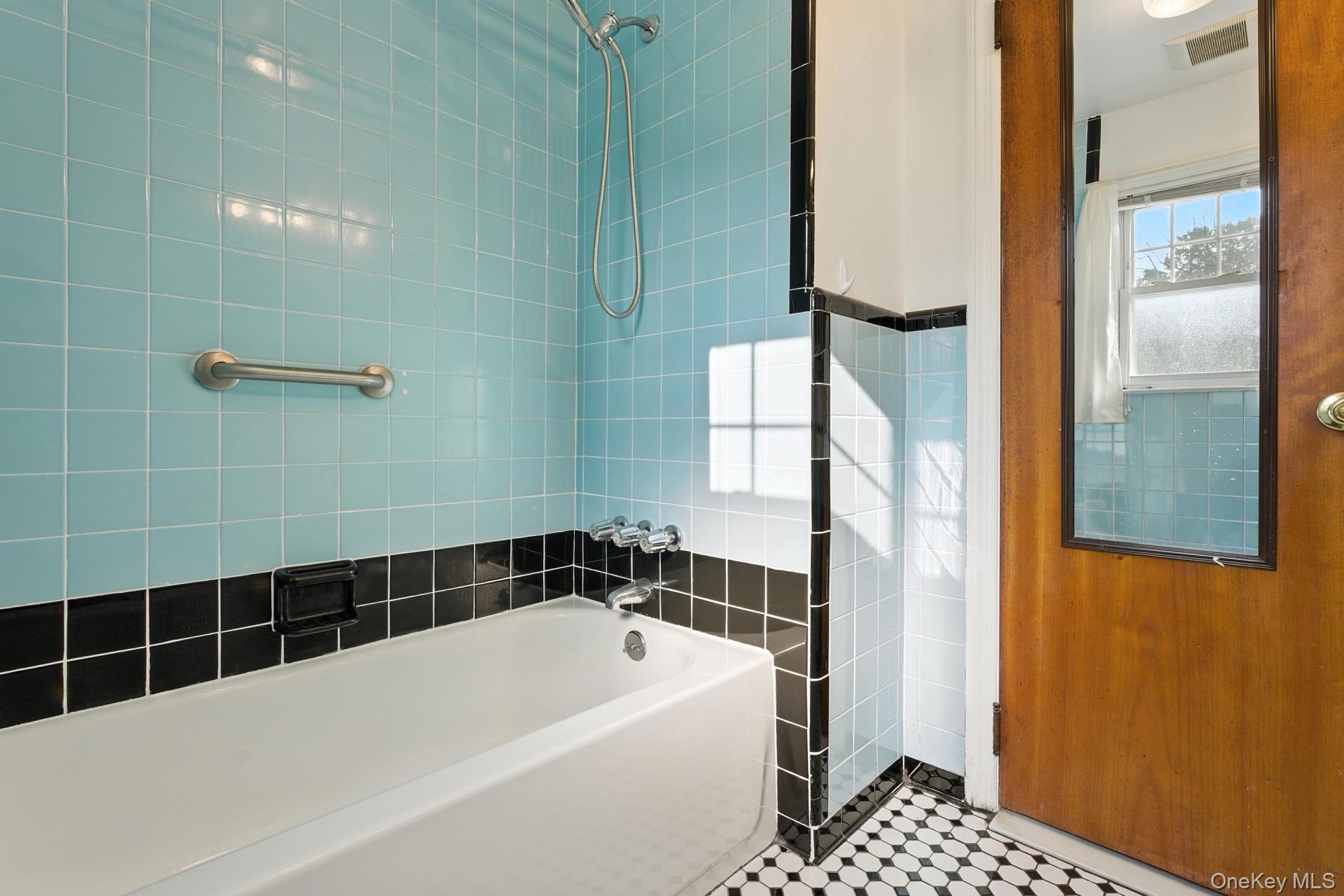 1547 Walt Whitman Road Melville, NY 11747 - Photo 11 of 25 a bathroom with a bathtub