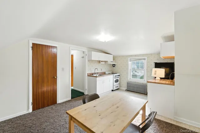 a kitchen with a refrigerator a stove top oven a sink and dishwasher