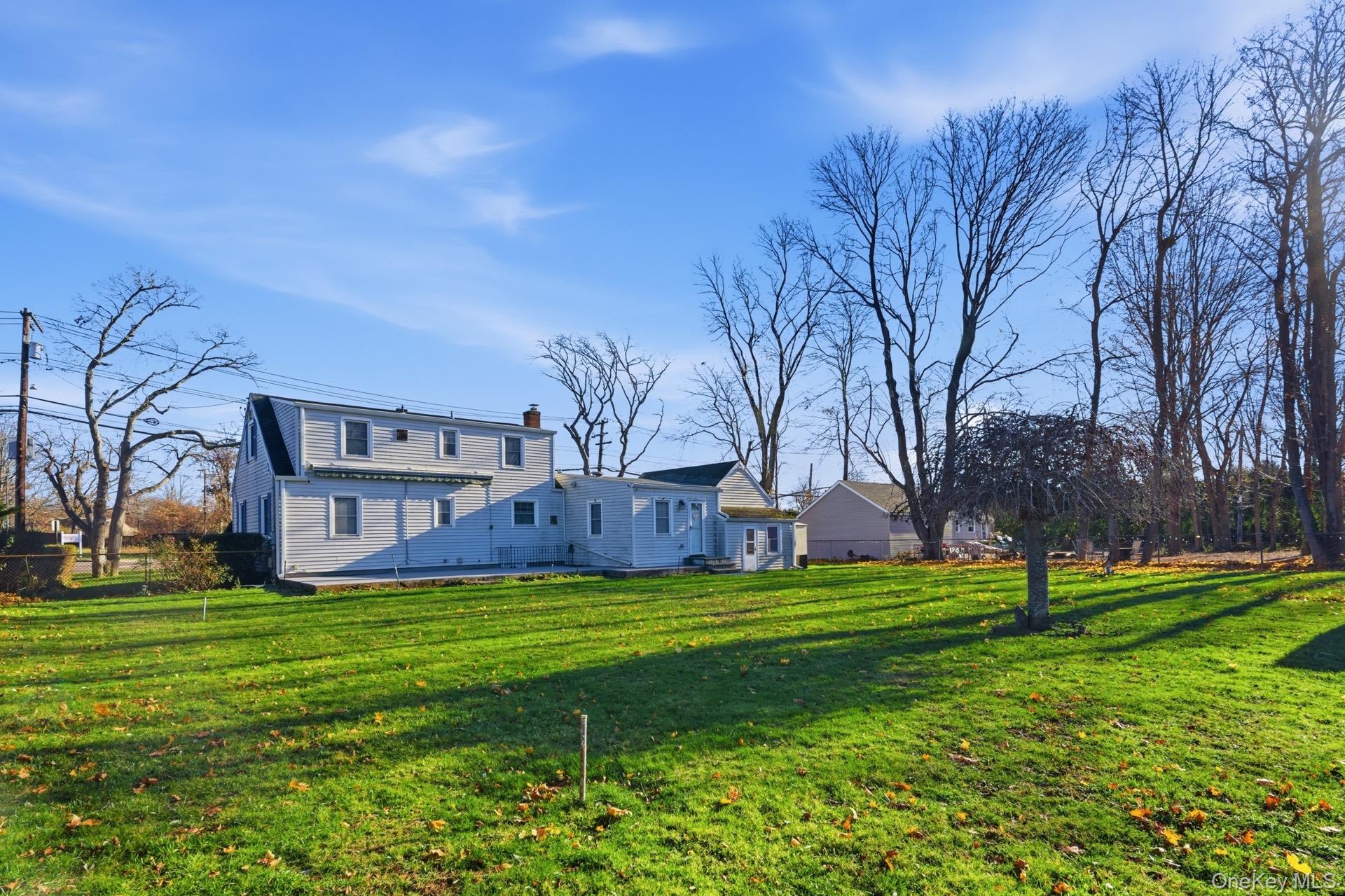 1547 Walt Whitman Road Melville, NY 11747 - Photo 21 of 25 a view of a park with large trees