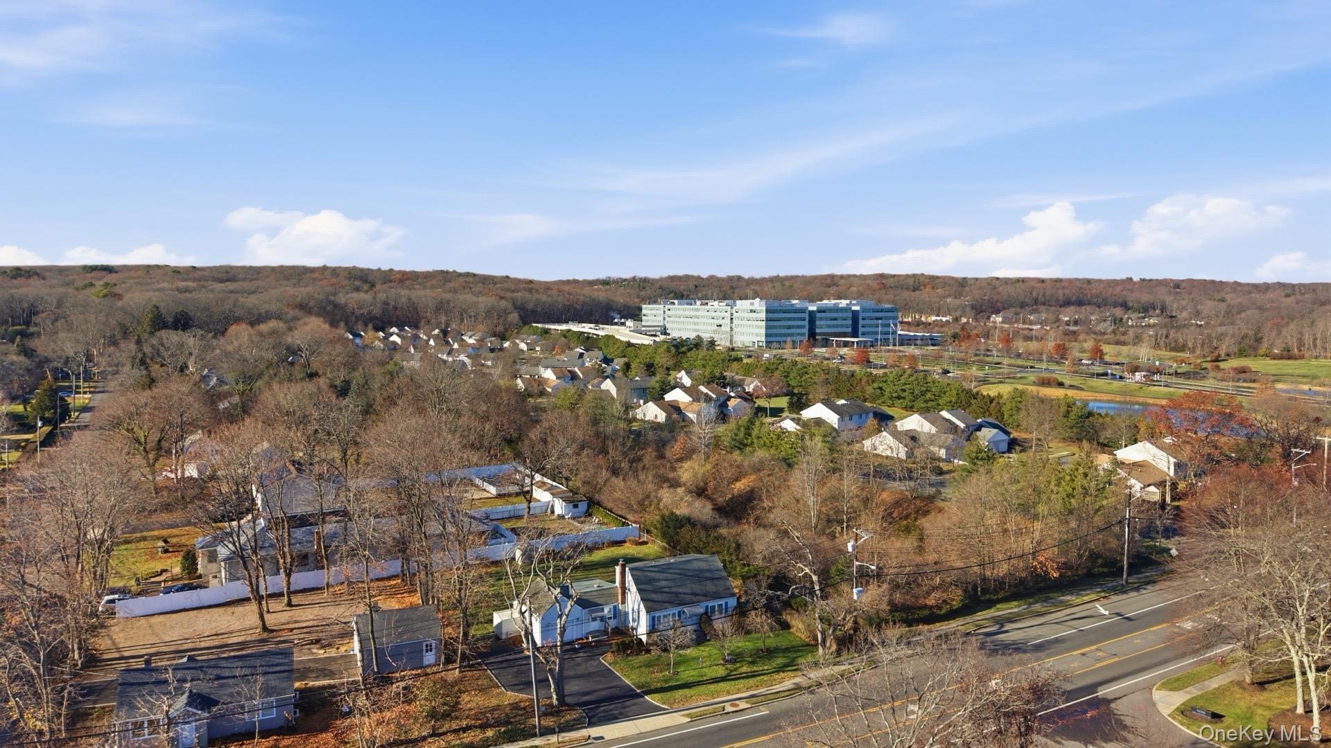 1547 Walt Whitman Road Melville, NY 11747 - Photo 23 of 25 an aerial view of multiple house