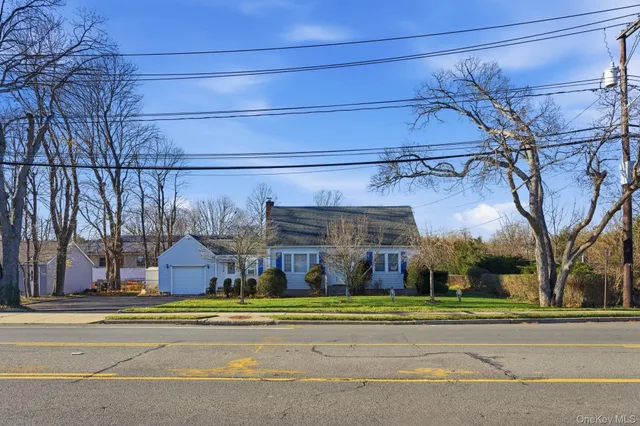 a view of a building with a cars on the road