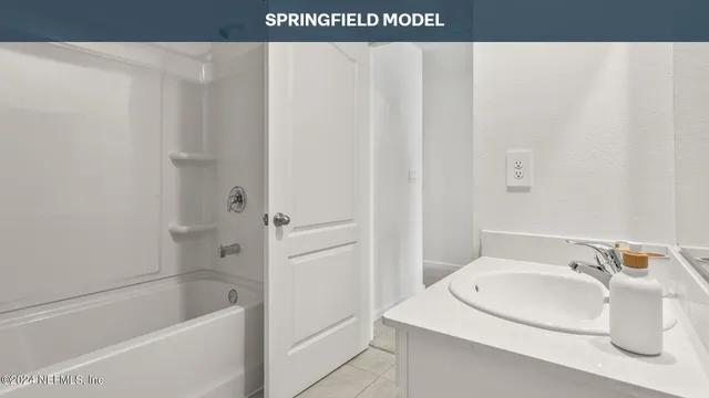 a bathroom with a sink and a bathtub