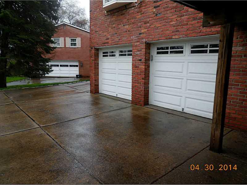 257 Lytton Road Coraopolis, PA 15108 - Photo 22 of 25 Exterior Back. Around back, down the exposed aggregate driveway, you will find plenty of parking for all your family & guests. 2 updated garage doors with automatic openers are included. There is room for a basketballhoop!