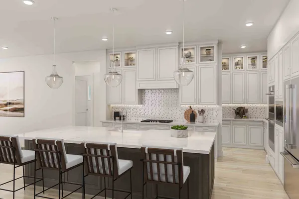a kitchen with a dining table chairs cabinets and stainless steel appliances