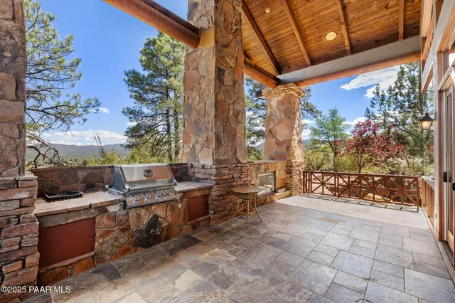 a view of kitchen with stainless steel appliances cabinets and wooden floor