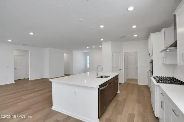 a view of kitchen island wooden floor
