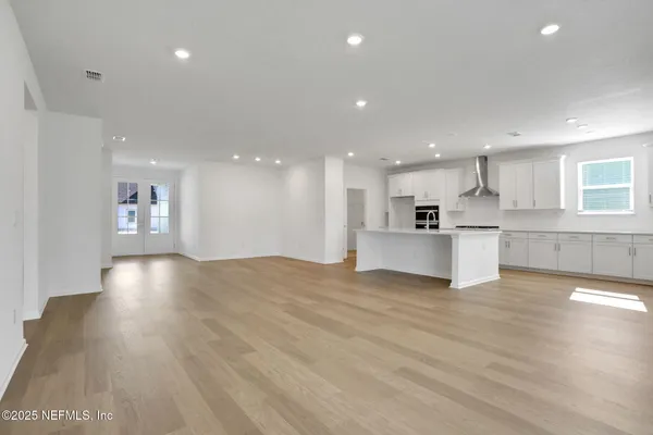 a view of a kitchen with a sink and a stove top oven