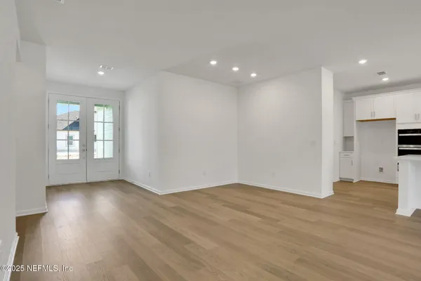 a view of a kitchen with a sink and a window
