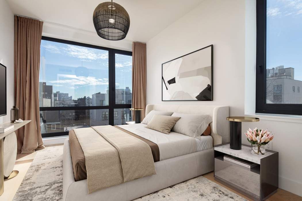550 Metropolitan Avenue, Unit PHA Brooklyn, NY 11211 - Photo 3 of 11 a bedroom with a large bed and a large window