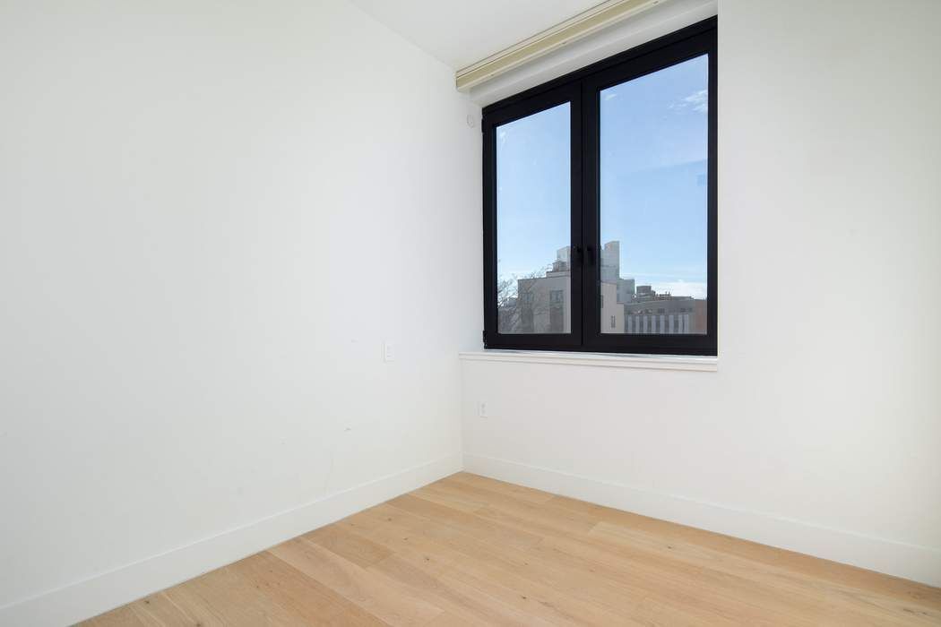 550 Metropolitan Avenue, Unit PHA Brooklyn, NY 11211 - Photo 7 of 11 a view of empty room with a window