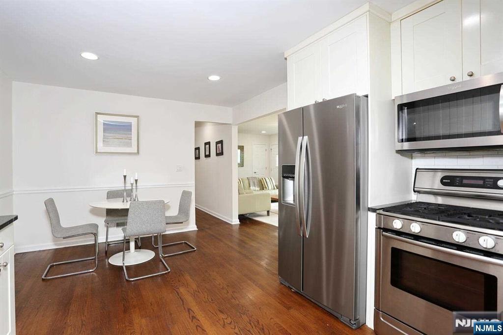 11 Evans Road Cresskill, NJ 07626 - Photo 11 of 31 a kitchen with a refrigerator microwave and stove top oven