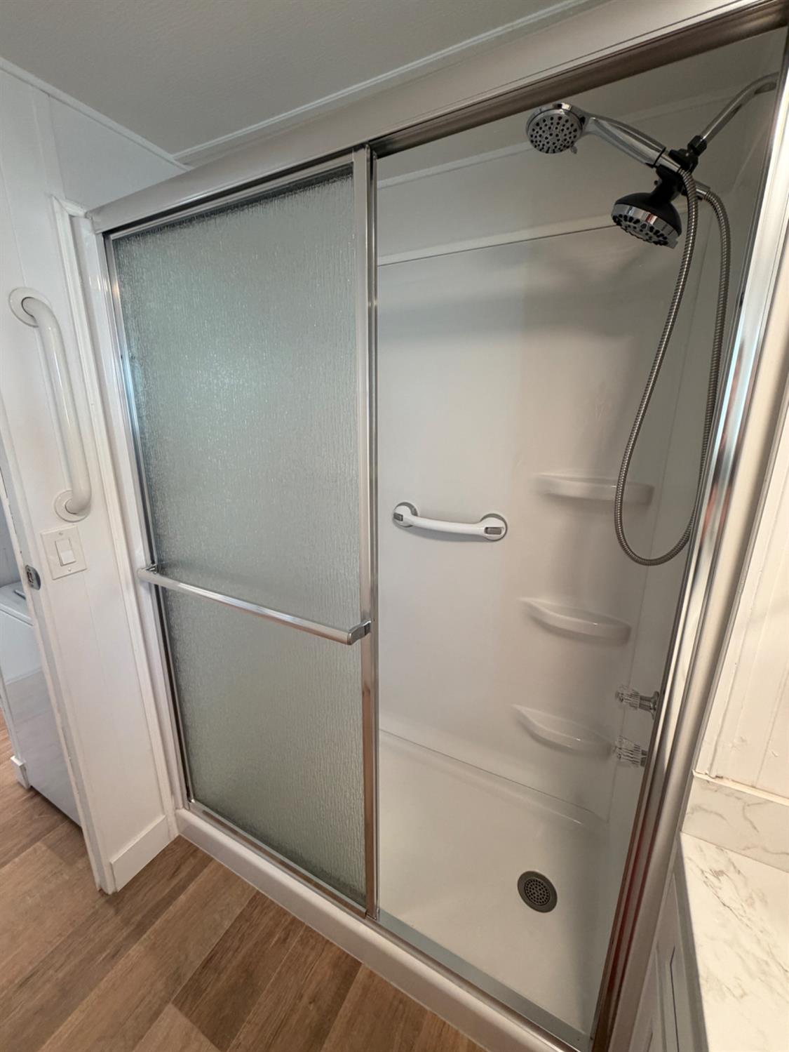 9060 Auburn Folsom Road, Unit 19 Granite Bay, CA 95746 - Photo 13 of 30 a bathroom with a glass shower door