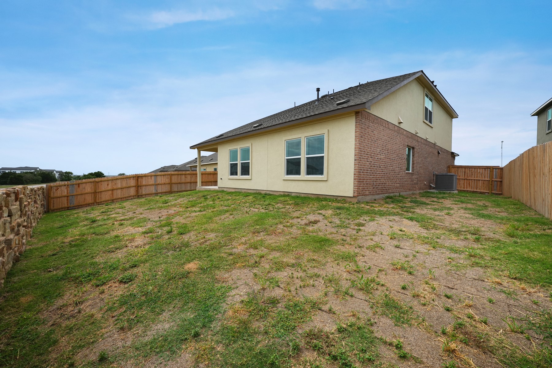 932 Mallow Road Leander, TX 78641 - Photo 32 of 34 A private, fenced backyard offers ample space for outdoor living and recreation.