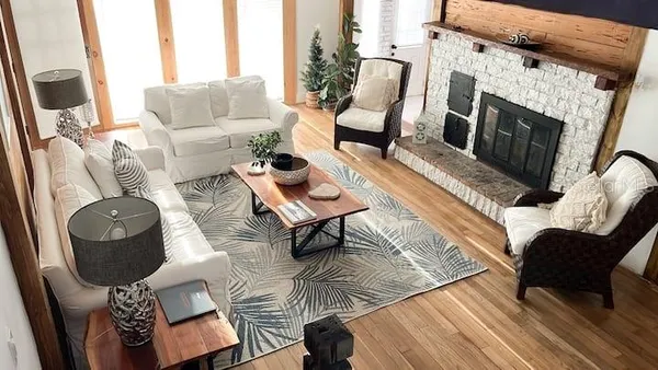 a living room with furniture and a fireplace