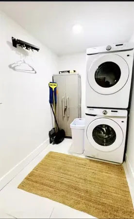 a view of a kitchen with a washer and dryer